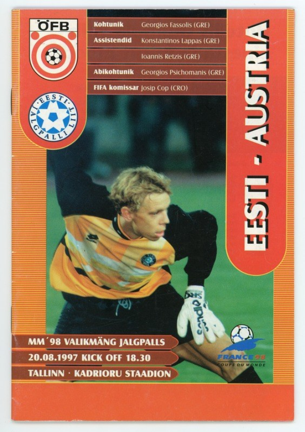 Soccer card from the 1998 FIFA World Cup in Germany featuring a player in a jersey with a determined expression against a bright blue sky with white clouds.
