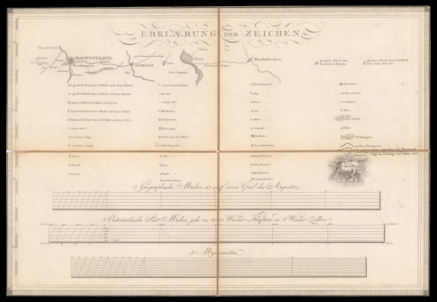 Ein altes Buch mit schwarzem Einband und einer Deutschlandkarte, aufgeschlagen auf einer Text- und Zeichnungseite.